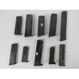 Ten assorted pistol magazines, one being