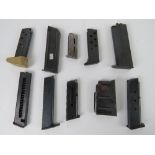 Ten assorted pistol magazines, one being