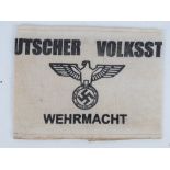 A WWII German Volsturm arm band, in frame.