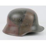 A reproduction German M17 helmet with liner.
