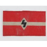 A WWII German Hitler youth arm band, in frame.