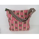 A fabric tote bag having leaf pattern in pink 'as new', approx 38 x 34cm.