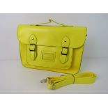 A Neon yellow satchel type handbag 'as new', approx 33 x 23cm.