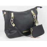 A black Michael Kors handbag having purse within, lining a/f near pocket 34 x 26cm.