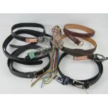 A quantity of assorted belts inc four 'as new' leather belts burgandy size 40,