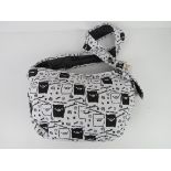 A cross body fabric bag having pig themed pattern 'as new', approx 40 x 24cm.