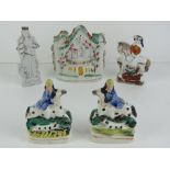 Five assorted miniature Staffordshire items including horse riders, flat back house, etc.