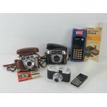 Three vintage cameras including Kodac Retinette, Halina and Mastra V35.