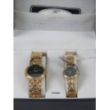 A 'His and Hers' stainless steel gents wristwatch and ladies wristwatch set, in presentation box.