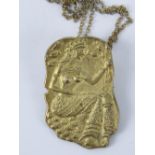 An unusual African silver gilt pendant/brooch in the form of a fertility goddess, 800 marks to back.