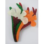 An overlaid plastic brooch in the style of Lea Stein in the form of a floral bouquet,