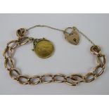 A vintage 9ct rose gold charm bracelet with heart padlock clasp, hallmarks to links,