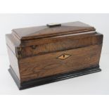 A fine quality Georgian rosewood sarcophagus tea caddy, original paper lined compartment,