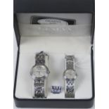 A 'His and Hers' stainless steel gents wristwatch and ladies wristwatch set, in presentation box.