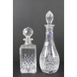 An Edinburgh crystal decanter having original labels upon and standing 34.5cm high.