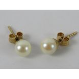 A pair of 9ct gold and pearl stud earrings.