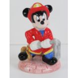 A Walt Disney ceramic figurine of 'Fire Fighter' Mickey Mouse, 11.5cm high.