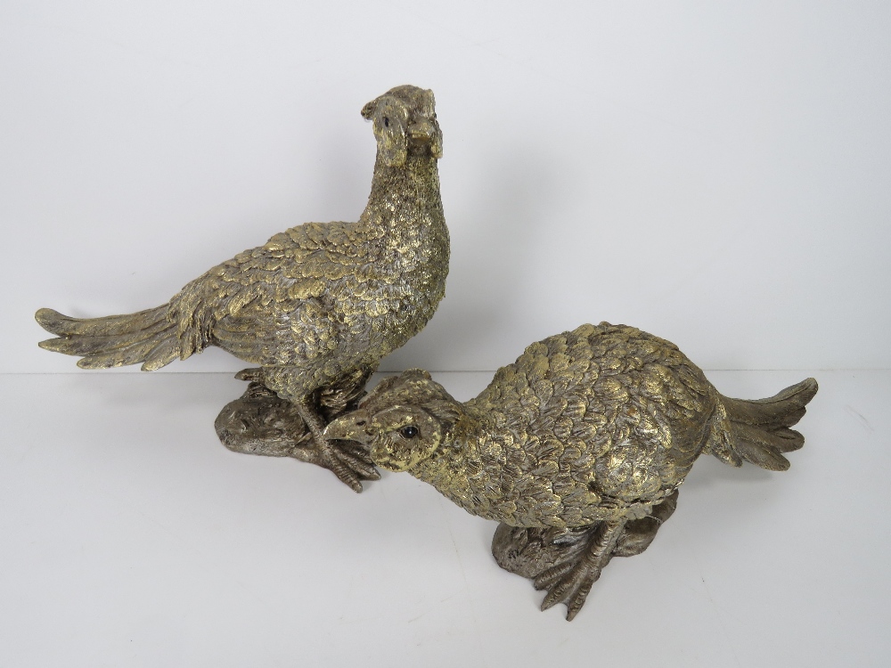 A pair of gold painted pheasant table decorations, one standing 23.