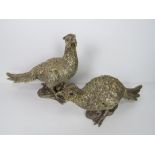 A pair of gold painted pheasant table decorations, one standing 23.