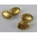A pair of 18ct gold cufflinks having gothis style monogram engraved to each side,