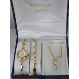 A Seconda ladies wristwatch gift set comprising; watch, bracelet and necklace. In original box.