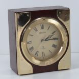 A Citizen mantle clock having brass fittings and Quartz movement, standing 13cm high.