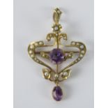 An Art Nouveau amethyst and seed pearl brooch/pendant,