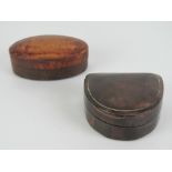 Two leather covered stud boxes manufactured by and stamped Harrods,