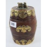 A delightful Oriental hardwood lidded barrel profusely decorated with gilt brass adornments and Fo