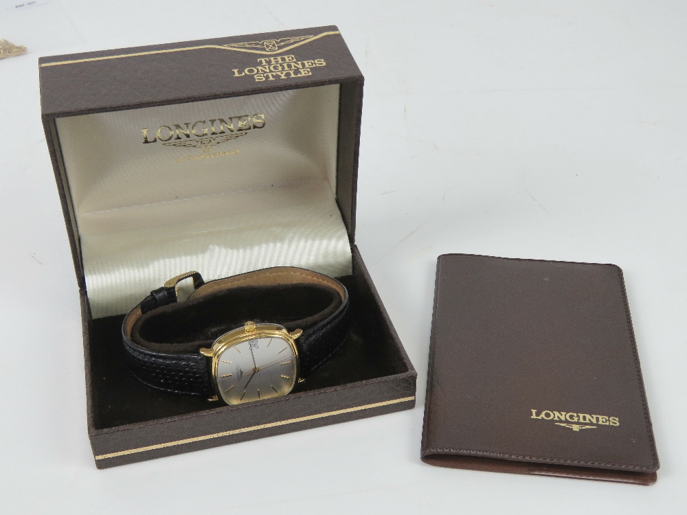 A c1980s Longines gold plated wristwatch on black reptile calf strap, with box and papers.