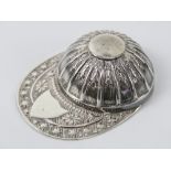 A HM silver caddy spoon in the form of a jockeys peaked riding hat, hallmarked Sheffield 1971, 10.