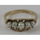 A 9ct gold and pearl ring, the basket setting holding five graduated pearls, hallmarked 375, 2.1g.