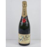 A hand signed bottle of Moet & Chandon Brut Imperial champagne.