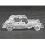 A glass paperweight in the form of a vintage Citroen motorcar, 19cm in length.