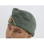 A WWII German Signals side cap.