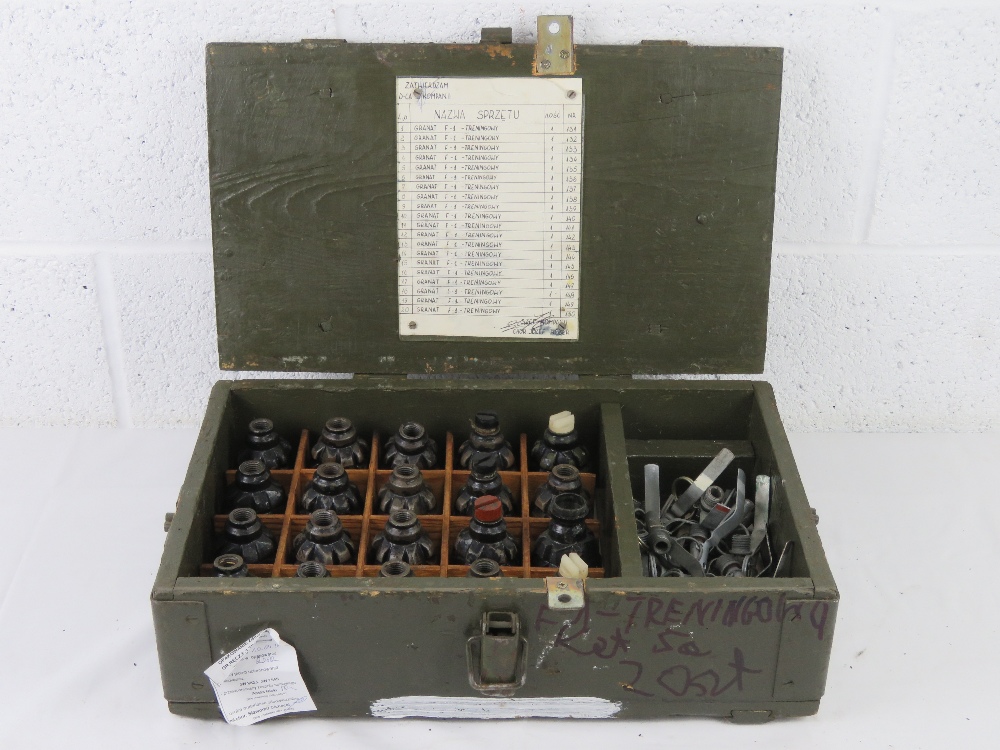 A box containing a quantity of twenty inert F1 Limonka grenades with pins and fuses.