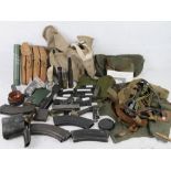 A quantity of militaria inc L12A1 Flare, MG34 leather sling, MG42 breach cover, SA80 magazine,