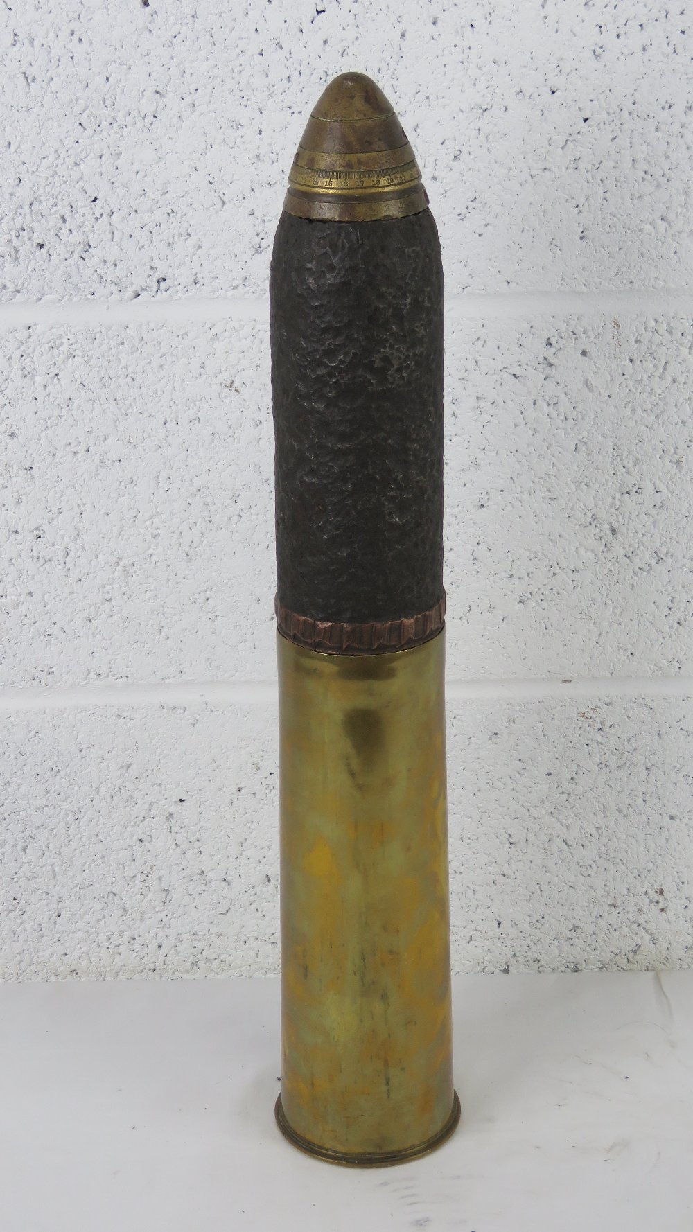 A British 18pr shell dated 1918 with head and fuse.