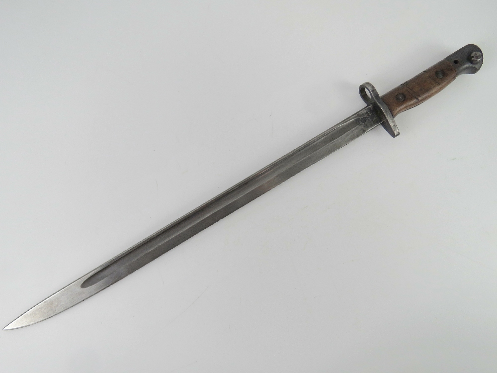 An SMLE 1907 pattern bayonet made by Wilkinson having inspection marks upon,