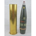 A WWII German 10.5cm separately loaded smoke round, dated 1937 and having German markings upon.