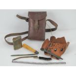 A WWII German MP34 gunners kit in brown leather pouch with strap.