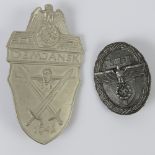 A WWII German Demjansk 1942 badge, together with another WWII German badge.