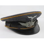 A WWII German Luftwaffe NCOs visor cap, size 57, slightly a/f.