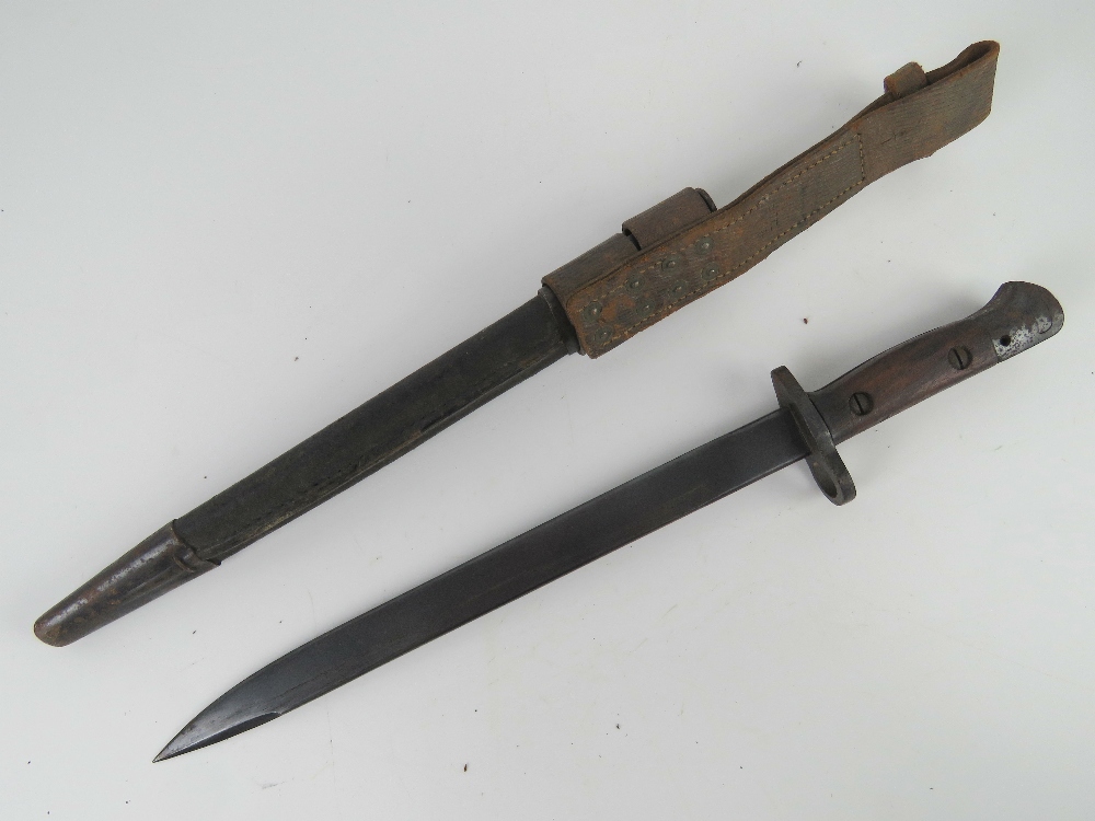 An Indian SMLE bayonet having wooden grips and 30.5cm blade, with leather scabbard and frog. - Image 2 of 4