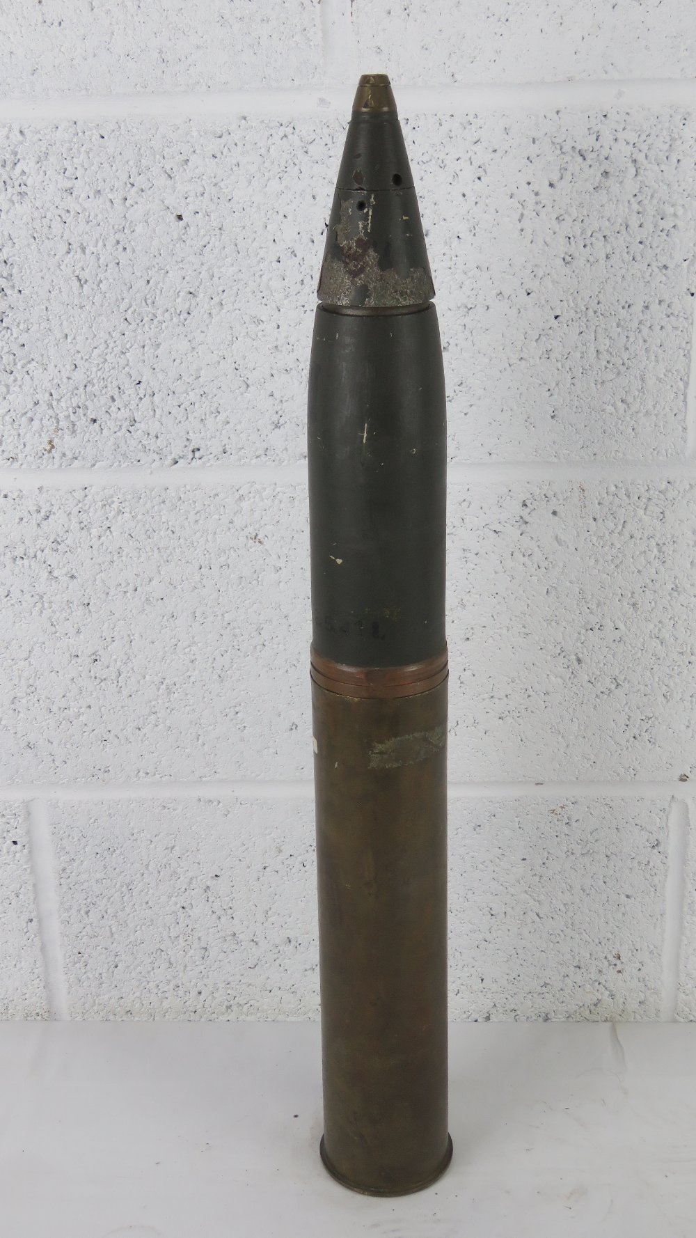 A WWII German 8cm M30 inert shell dated 1940, together with head and fuse, dated 1941.