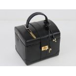 A contemporary black leather jewellery case having various compartments within.