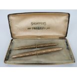 A Sheaffer's 'new snorkel pen set' in box being fountain pen and propelling pencil, slightly a/f.