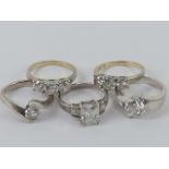 Five silver rings set with white stones sizes M-O, each stamped 925.