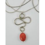 A handmade white metal and red hardstone pendant on 925 silver chain, pendant 4.8cm in length.