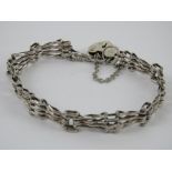 A HM silver fancy bar link bracelet having heart padlock clasp,